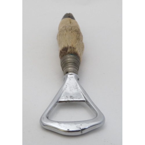 179 - A 20thC nickel plated bottle opener with deer slot / foot handle 7 1/2'' long