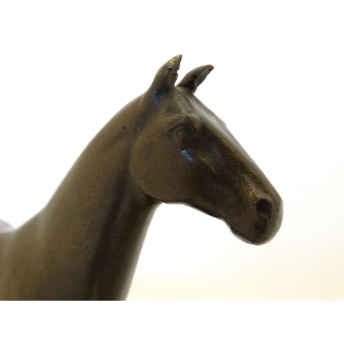 181 - Equine / Hose Racing : A late 20thC bronze model of a horse. Signed ' ANDRE',  mounted upon a marble... 