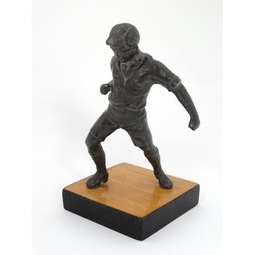 186 - A mid 20thC cast metal model of a footballer? Probably Russian. On wooden base. The whole 6 3/4'' hi... 