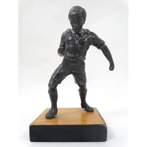 186 - A mid 20thC cast metal model of a footballer? Probably Russian. On wooden base. The whole 6 3/4'' hi... 