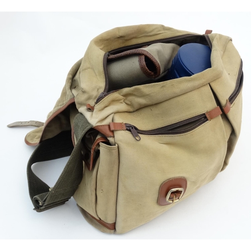 212 - Fishing: A Bob Church & Co fishing bag of leather trimmed canvas (fly fisherman's shoulder bag) open... 