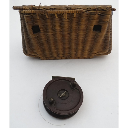 229 - River Fly Fishing: A split reed fishing reel opening to reveal a Bakelite centre pin 3 3/4'' (Alcock... 