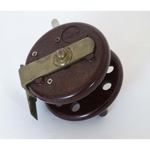 230 - Fishing :A Modern Arms Co Bakelite Trotting Reel with two handles and 8 holes, free run and clicker ... 