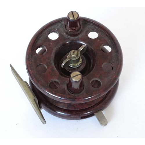 230 - Fishing :A Modern Arms Co Bakelite Trotting Reel with two handles and 8 holes, free run and clicker ... 