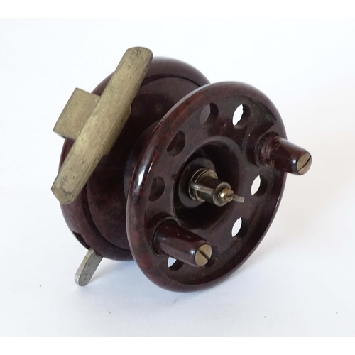 230 - Fishing :A Modern Arms Co Bakelite Trotting Reel with two handles and 8 holes, free run and clicker ... 