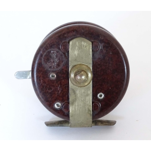 230 - Fishing :A Modern Arms Co Bakelite Trotting Reel with two handles and 8 holes, free run and clicker ... 