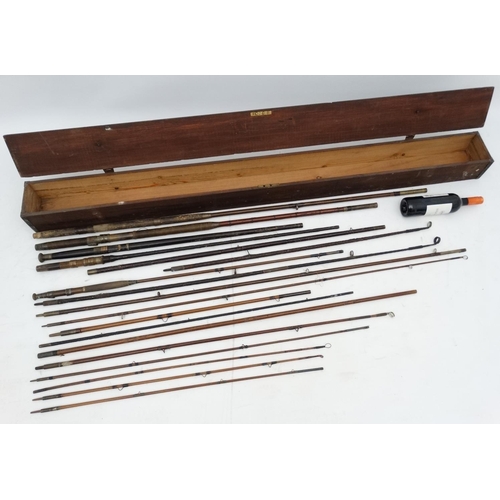 248 - Fishing: An old stained pine travelling rod box opening to reveal several early 20th C cane rods wit... 