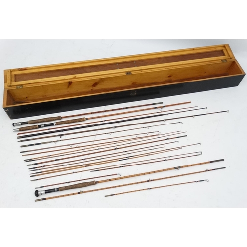 249 - A mid-Late ebonised wooden travelling rod box opening to reveal several split cane rods for restorat... 