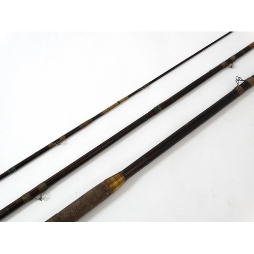 255 - Fishing : A traditional  11' , 3 piece stained cane bound rod with an associated cloth case