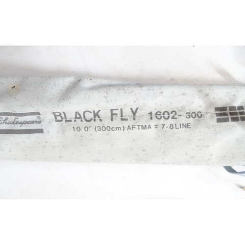 289 - Fly fishing : a fibre glass lightweight 2 sectional fly rod together with a Shakespeare Black Fly 16... 