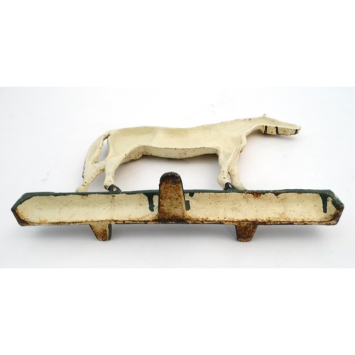 327 - A cast iron doorstop formed as a horse with polychrome decoration. 10'' high