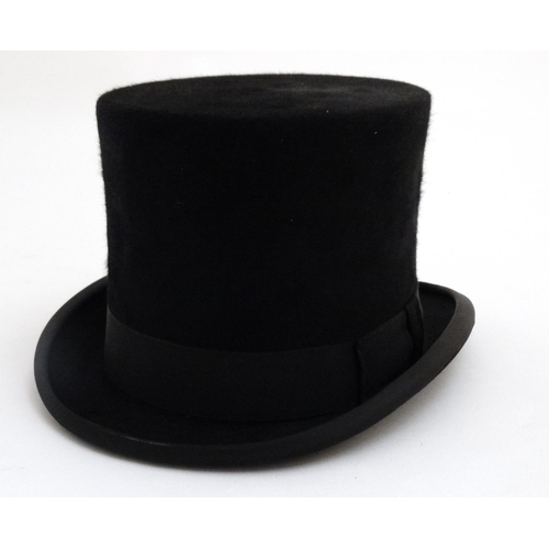 330 - A '' Christys' of London '' 100% fine fur felt handmade black top gentleman's top hat, with white si... 