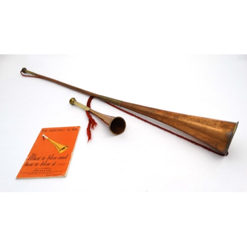 340 - Hunting : A long copper and brass hunting / coaching horn  34 1/2'' long, together with a short copp... 