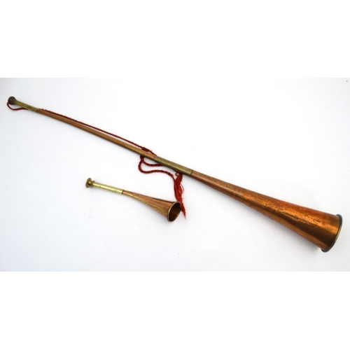 340 - Hunting : A long copper and brass hunting / coaching horn  34 1/2'' long, together with a short copp... 