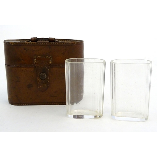 342 - Field Sports : A pair of  late 19thC / early 20thC glass beakers contained within a brown leather ca... 