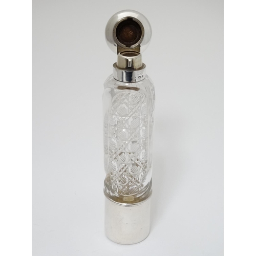 429 - A cut glass ladies hip flask of cylindrical form with silver top, mounts and beaker to lower. Hallma... 