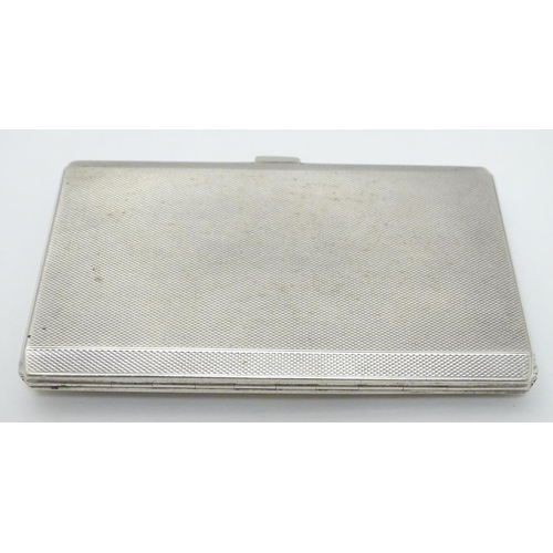 435 - A silver cigarette case hallmarked Birmingham 1947 having later applied ceramic cabochon depicting w... 