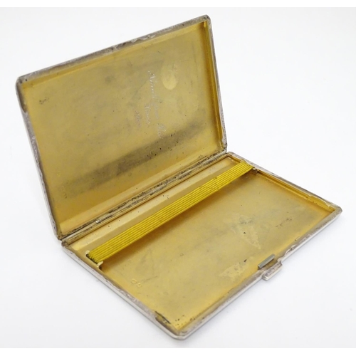 435 - A silver cigarette case hallmarked Birmingham 1947 having later applied ceramic cabochon depicting w... 