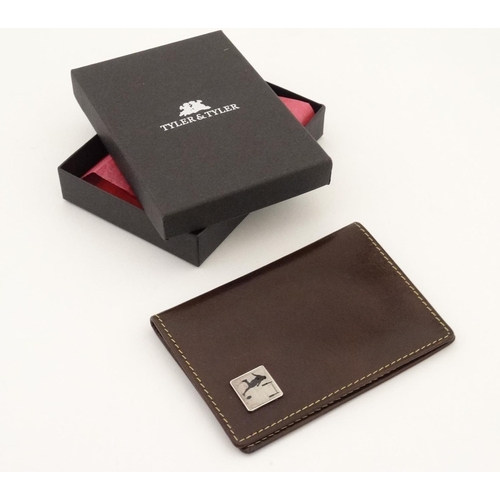 442 - Rugby interest: A Tyler & Tyler leather card holder with image to one corner of a rugby player in si... 