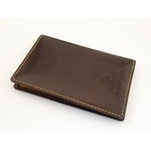 442 - Rugby interest: A Tyler & Tyler leather card holder with image to one corner of a rugby player in si... 