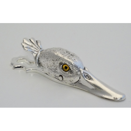 444 - A silver plate desk top letter clip in the form of a ducks head. 21stC.  5'' long