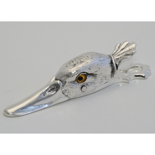 444 - A silver plate desk top letter clip in the form of a ducks head. 21stC.  5'' long