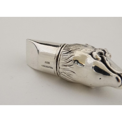 457 - A silver whistle with wild boar head decoration. marked '925 Sterling '. 21stC.  approx 1 3/4'' long