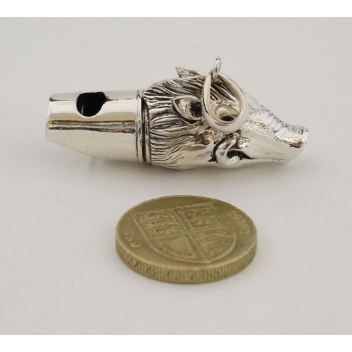 457 - A silver whistle with wild boar head decoration. marked '925 Sterling '. 21stC.  approx 1 3/4'' long