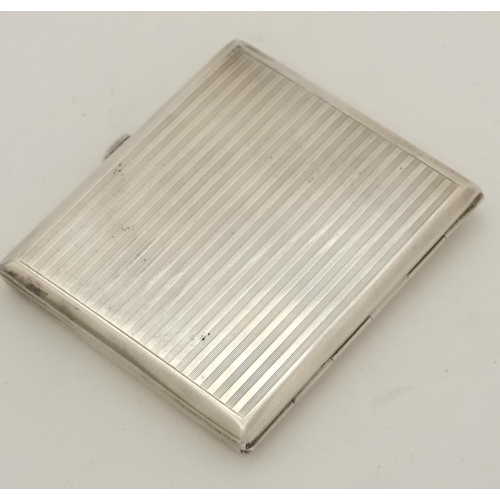 458 - A Continental 900 silver cigarette case with engine turned decoration and enamel scene to front depi... 