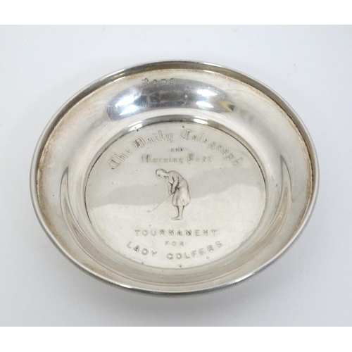 460 - Golfing interest ( Lady Golfers): A silver pin dish / trophy with embossed image of a female golfer ... 