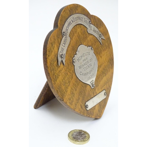 470 - Golfing Interest : A silver mounted oak presentation / trophy shield for Carnavonshire & District Go... 