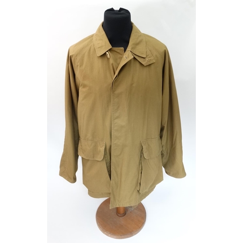 477 - A Holland & Holland lightweight Loden lined Shooting Coat in tan brown, size approx. large