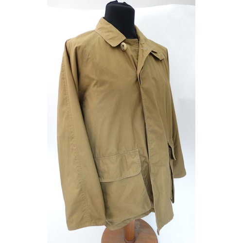 477 - A Holland & Holland lightweight Loden lined Shooting Coat in tan brown, size approx. large