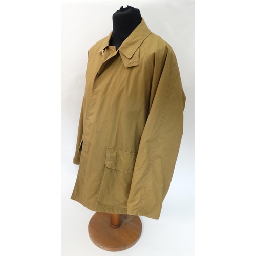 477 - A Holland & Holland lightweight Loden lined Shooting Coat in tan brown, size approx. large