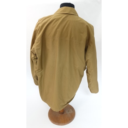 477 - A Holland & Holland lightweight Loden lined Shooting Coat in tan brown, size approx. large