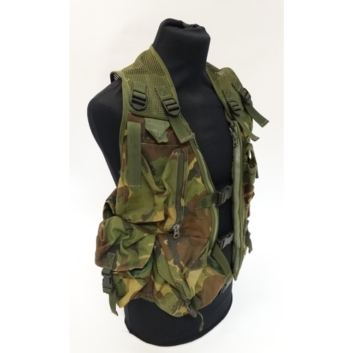 496 - A Cammo fishing  /hunting / photo waistcoat; multi pouches and pockets; mesh back and rucksack, Appr... 