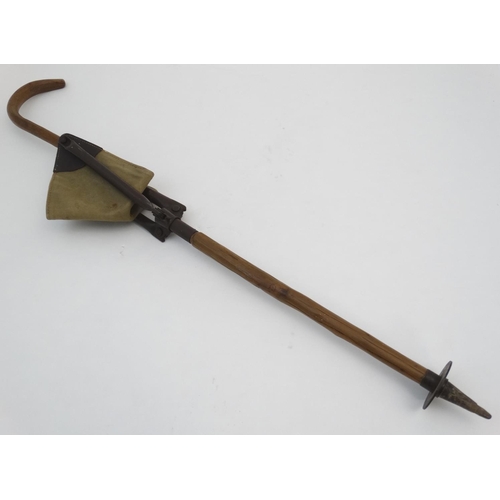 528 - Shooting stick: a mid 20thC shooting stick with triangular leather and canvas seat, the collar stamp... 