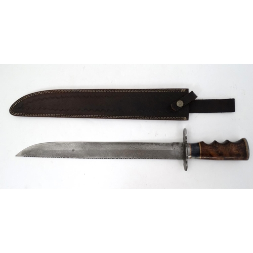 535 - A large hunting / pioneer knife , having a 16'' damascus blade with fuller and saw back . 5 1/4'' gr... 