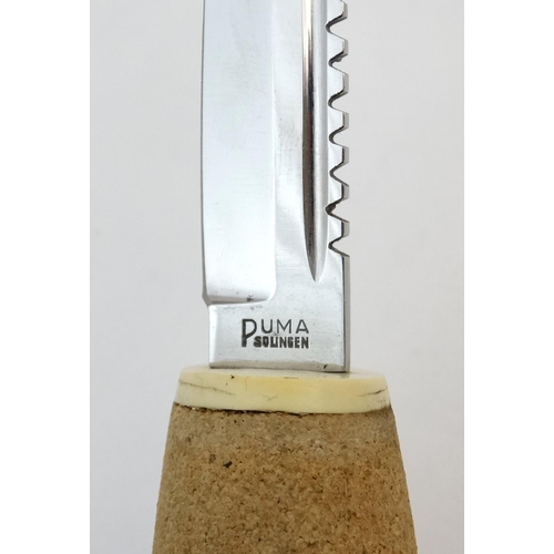 537 - A Fisherman's knife by Puma of Solingen, with 4 1/2'' cork (floating) handle, 3 1/2'' blade, in its ... 