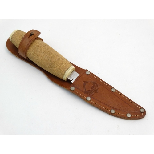 537 - A Fisherman's knife by Puma of Solingen, with 4 1/2'' cork (floating) handle, 3 1/2'' blade, in its ... 