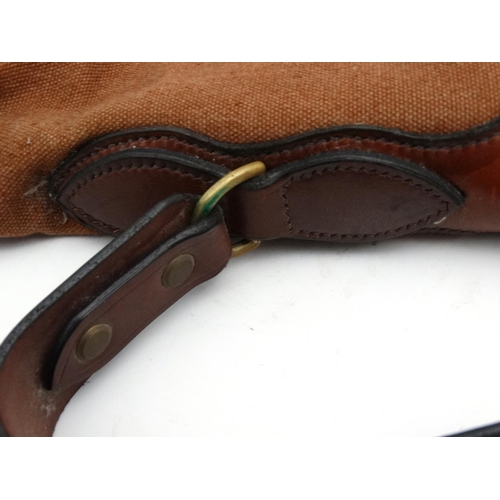 556 - Shooting: A heavy leather and canvas 'scoped rifle slip, of Spanish manufacture, the side panel stam... 