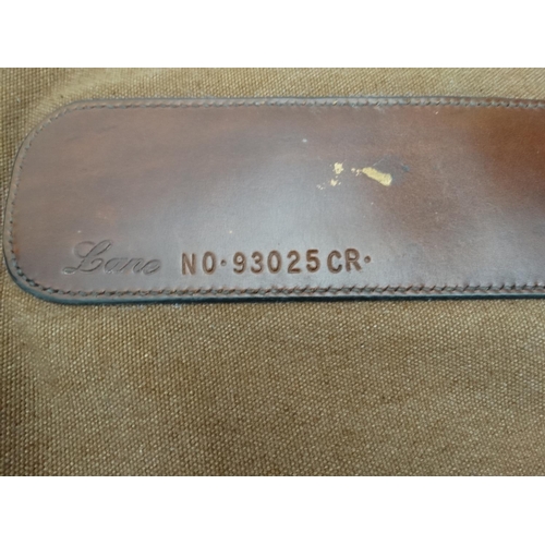 556 - Shooting: A heavy leather and canvas 'scoped rifle slip, of Spanish manufacture, the side panel stam... 