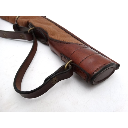 556 - Shooting: A heavy leather and canvas 'scoped rifle slip, of Spanish manufacture, the side panel stam... 