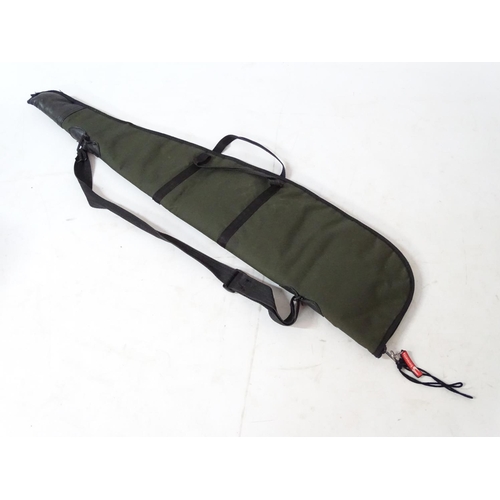 557 - Shooting : A 'scoped rifle slip , having green synthetic finish , 44'' long