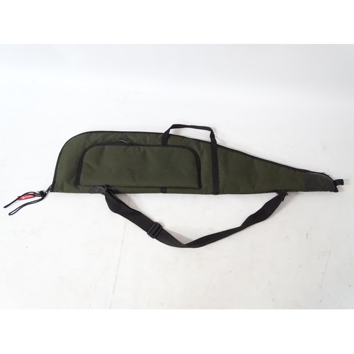 557 - Shooting : A 'scoped rifle slip , having green synthetic finish , 44'' long