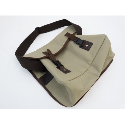 577 - Shooting: A Caesar Guerini canvas and leather range / game bag having large internal compartment wit... 