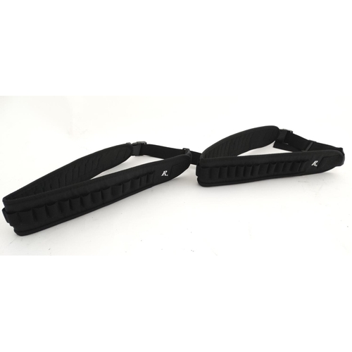 581 - Shooting : Two Remington cartridge belts , black synthetic finish , each approximately 44'' long