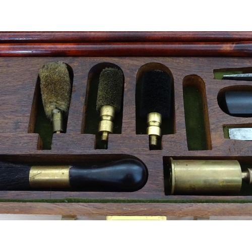 583 - Shooting: A William Powell presentation shotgun cleaning kit, of figured walnut construction, the in... 