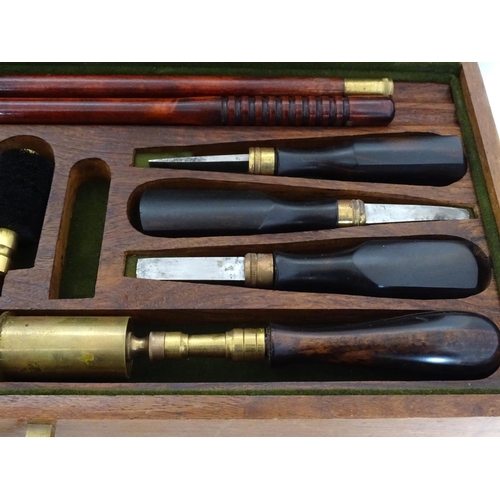 583 - Shooting: A William Powell presentation shotgun cleaning kit, of figured walnut construction, the in... 