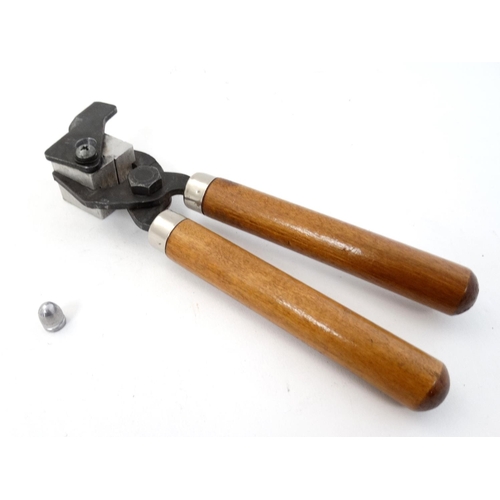 586 - Shooting : A hand-held Bullet mould , having plier action with hardwood grip . 8'' long